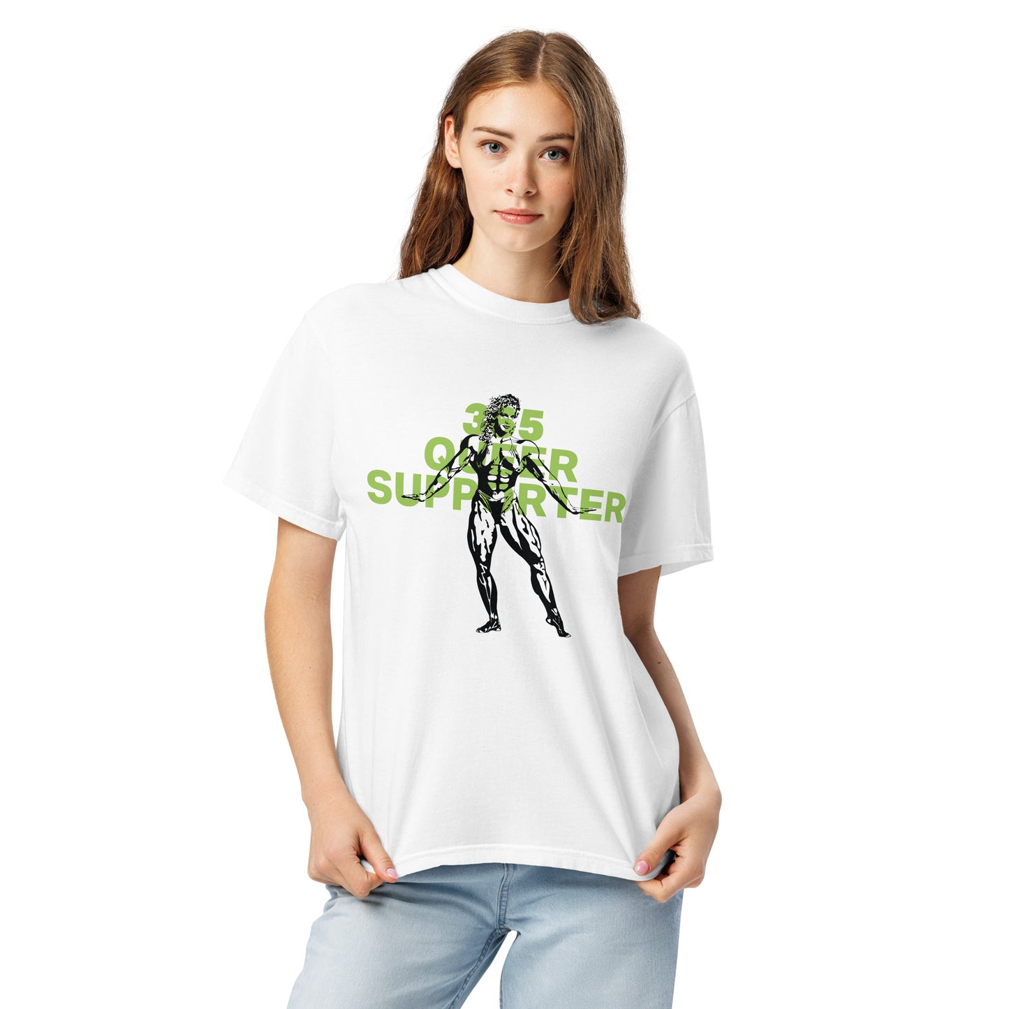 White t-shirt with the phrase ‘365 Queer Supporter’ in bold green lettering. Features a black illustration of a strong bodybuilder. Promotes year-round support for LGBTQ+ athletes and the belief that we should all be strong—together and as individuals. Designed by a queer-owned business. Shown on slender model.