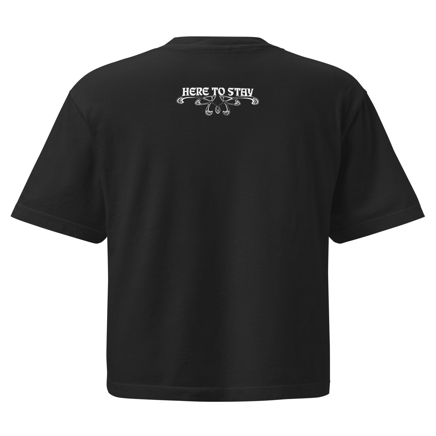 Black, boxy t-shirt. Featuring the phrase ‘Queer existence is the agenda’ on the front, ‘here to stay’ on the back. Design is in white, with a butterfly design on the front and an abstract design on the back. Design is in contrast to legislation that is based on eraser of queer people. Designed by a small LGBTQ+ owned business. Back of shirt.