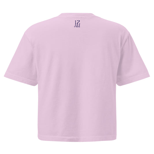 Orchid, back view, of boxy T-shirt featuring the phrase ‘My horoscope says I’m gay’ in a decorative blue typeface, gay as the moon. Playful nod to queer identity and astrology, embracing the idea that astrology is gay. Designed by a small LGBTQ+ owned business. Back of t-shirt.