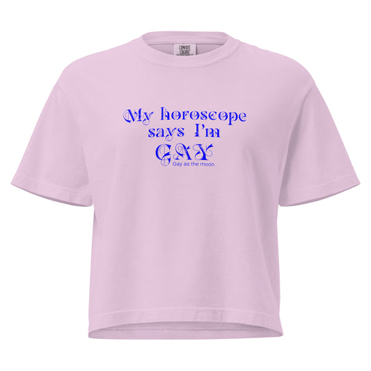 Orchid, boxy T-shirt featuring the phrase ‘My horoscope says I’m gay’ in a blue decorative typeface, gay as the moon. Playful nod to queer identity and astrology, embracing the idea that astrology is gay. Designed by a small LGBTQ+ owned business. Font of t-shirt.