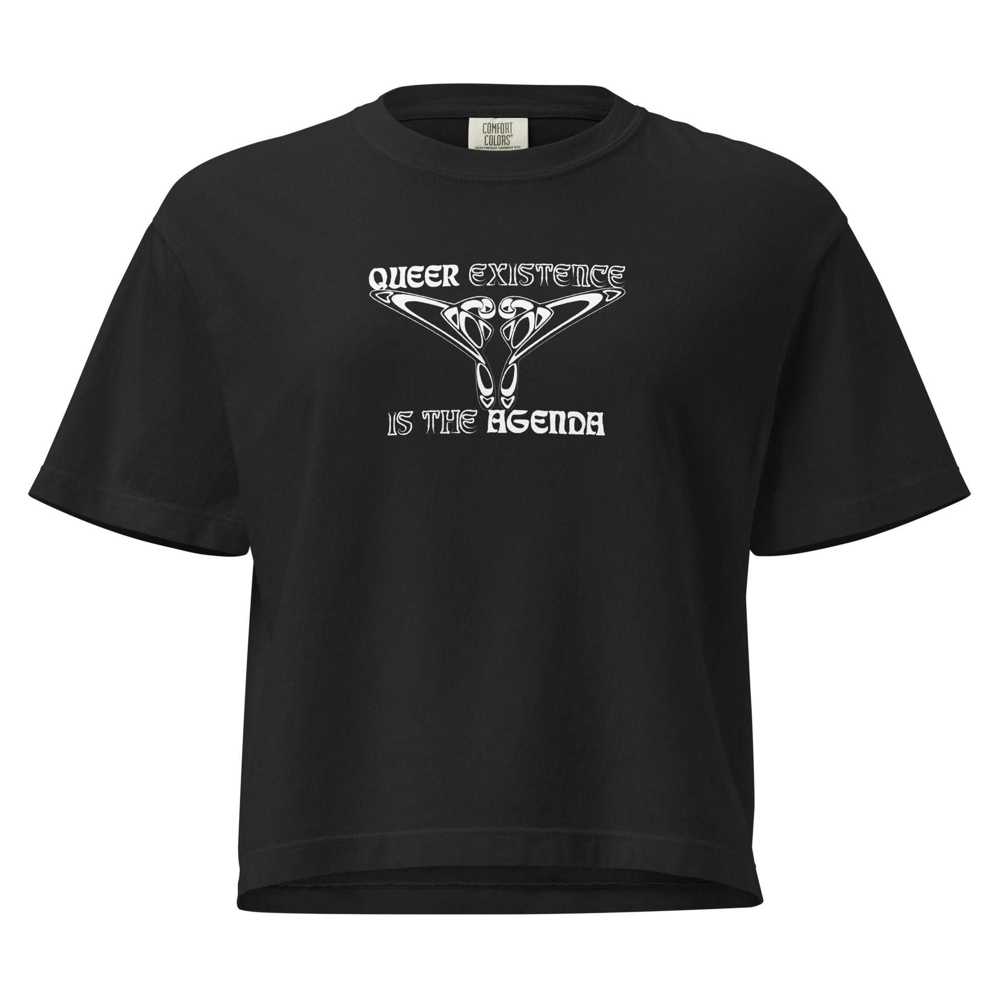 Black, boxy t-shirt. Featuring the phrase ‘Queer existence is the agenda’ on the front, ‘here to stay’ on the back. Design is in white, with a butterfly design on the front and an abstract design on the back. Design is in contrast to legislation that is based on eraser of queer people. Designed by a small LGBTQ+ owned business. Front of shirt. 