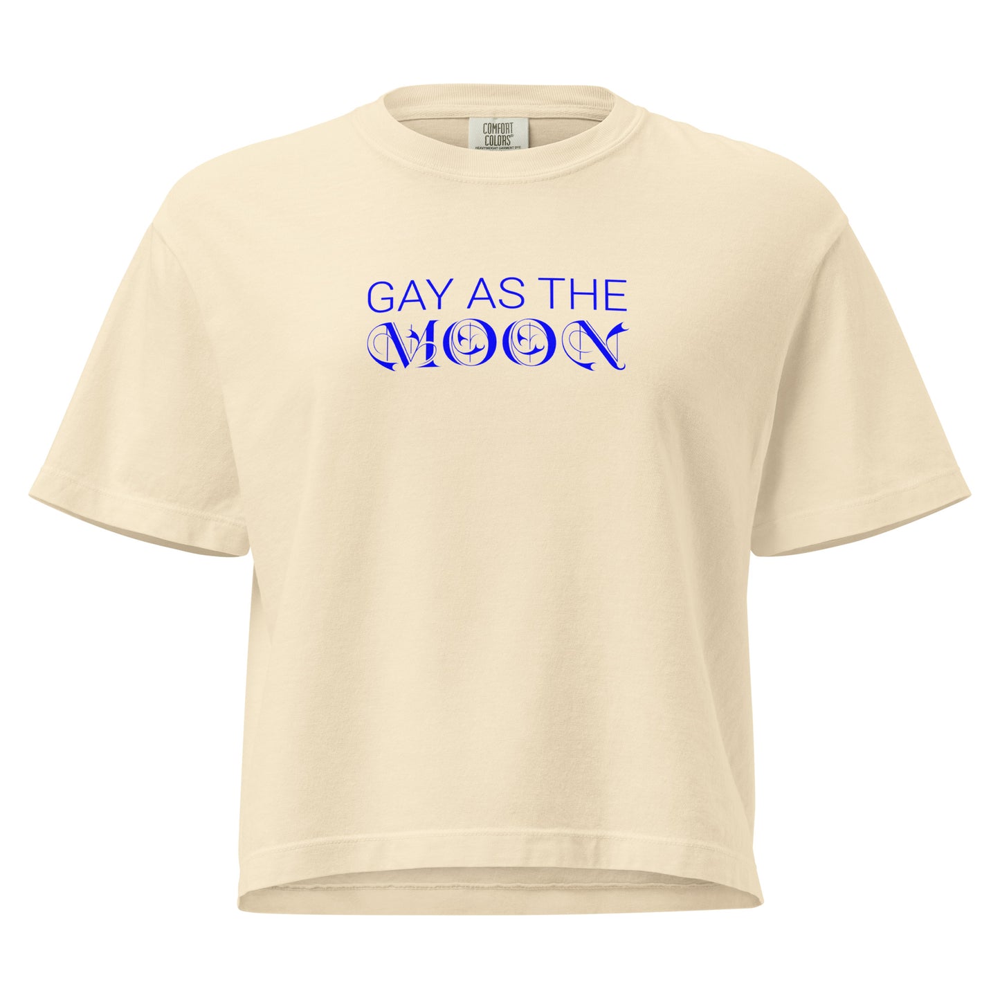 Ivory, boxy t-shirt featuring the phrase ‘Gay as the moon’ in a blue decorative typeface. Playful nod to queer identity and astrology, embracing the idea that the moon is gay. Designed by a small LGBTQ+ owned business. Front of shirt.