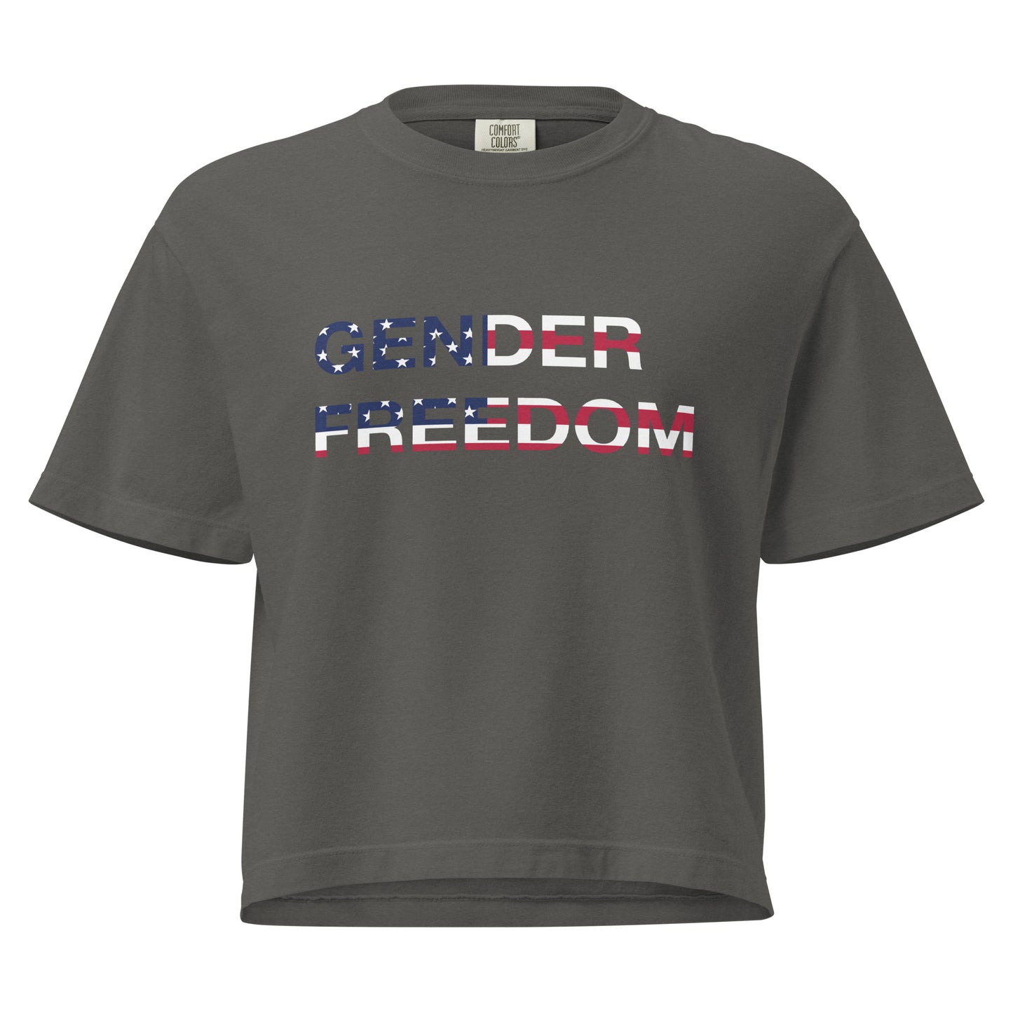 Pepper, boxy T-shirt featuring the phrase 'Gender Freedom’ over the American flag honoring the First Amendment and the patriotic right to express identity, speak truth, and live freely in the land of liberty. Designed by a small LGBTQ+ owned business. Front of shirt