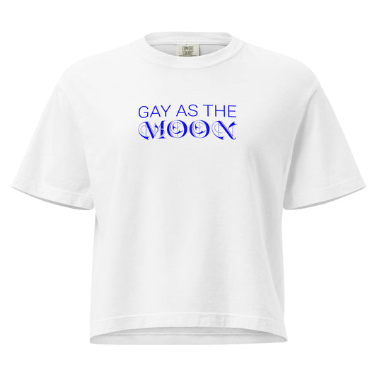 White, boxy t-shirt featuring the phrase ‘Gay as the moon’ in a blue decorative typeface. Playful nod to queer identity and astrology, embracing the idea that the moon is gay. Designed by a small LGBTQ+ owned business. Front of shirt.