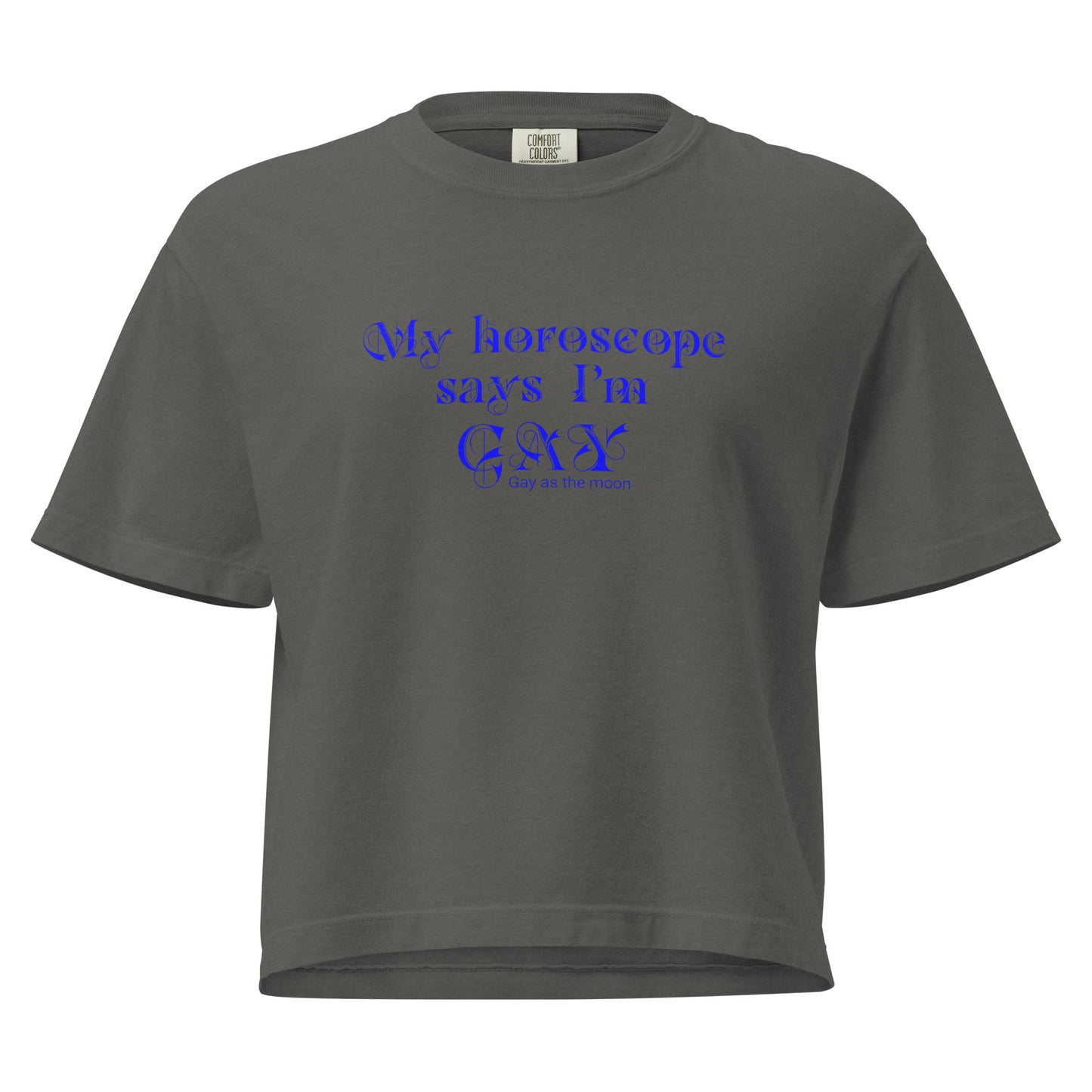 Pepper, boxy T-shirt featuring the phrase ‘My horoscope says I’m gay’ in a decorative blue typeface, gay as the moon. Playful nod to queer identity and astrology, embracing the idea that astrology is gay. Designed by a small LGBTQ+ owned business. Front of t-shirt. 