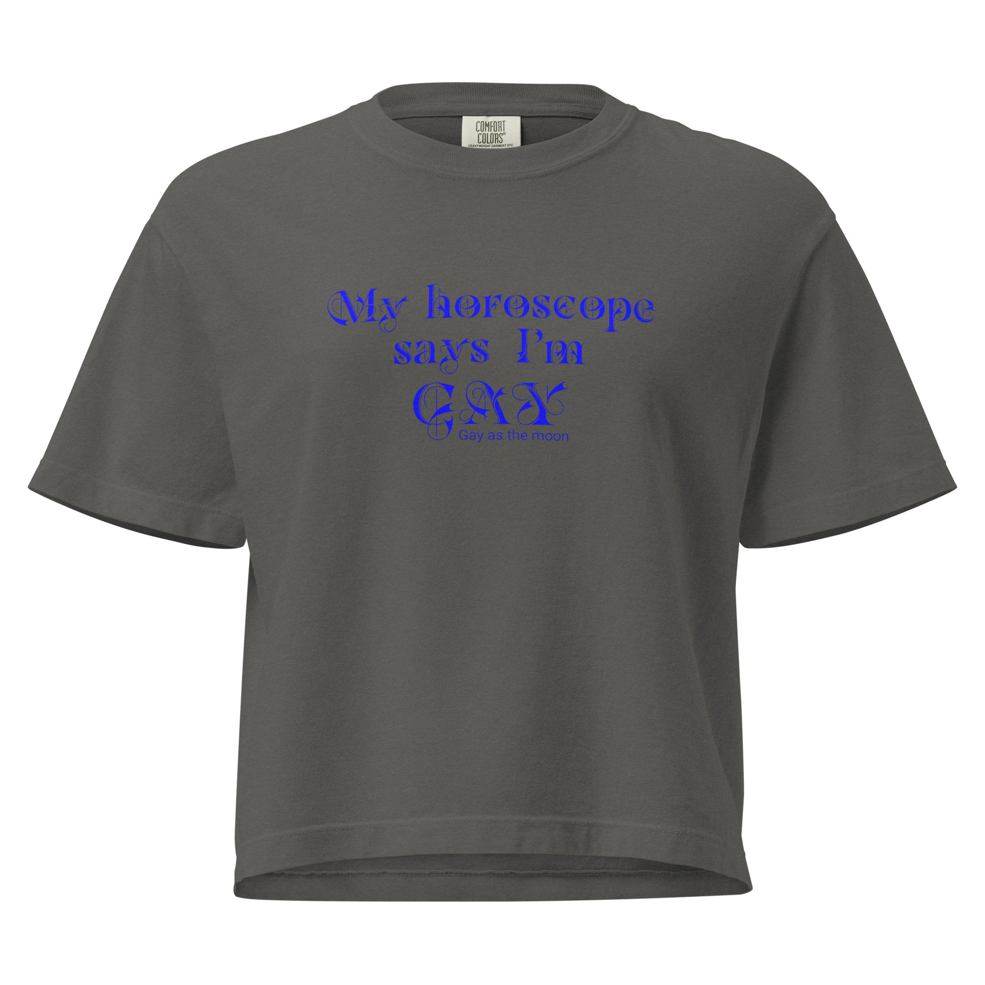 Pepper, boxy T-shirt featuring the phrase ‘My horoscope says I’m gay’ in a decorative blue typeface, gay as the moon. Playful nod to queer identity and astrology, embracing the idea that astrology is gay. Designed by a small LGBTQ+ owned business. Front of t-shirt. 