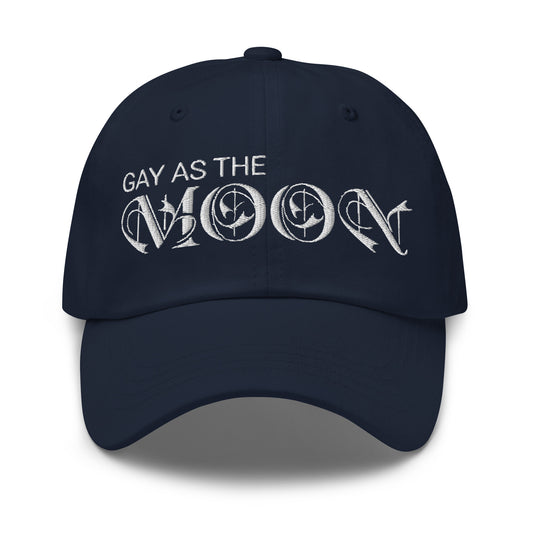 Navy blue hat, featuring the phrase ‘Gay as the moon’ in a decorative white typeface. Playful nod to queer identity and astrology, embracing the idea that astrology is gay. Designed by a small LGBTQ+ owned business. Front of hat. 