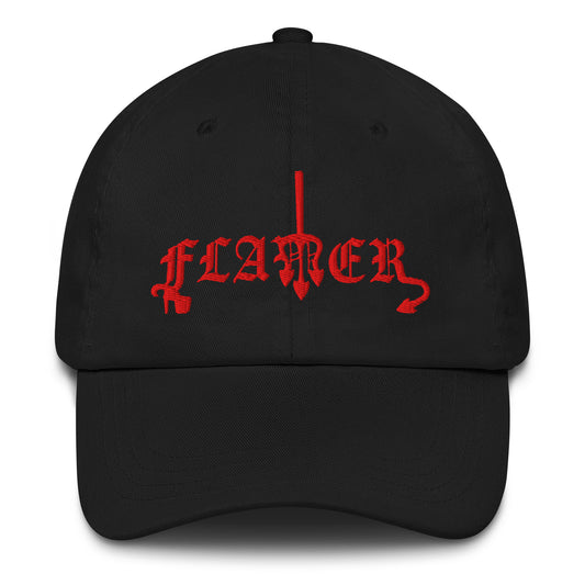 Black, classic dad hat featuring the word ‘Flamer’ in a bold, illustrative typeface. Reclaiming the phrase “flaming gay,” this design leans into a devil-mascot aesthetic to celebrate every queer who refuses to dim their fire. Designed by a small LGBTQ+ owned business. Front of hat.