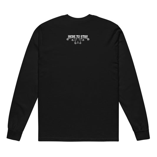 Black, long-sleeve shirt. Featuring the phrase ‘Queer existence is the agenda’ on the front, ‘here to stay’ on the back. Design is in white, with a butterfly design on the front and an abstract design on the back. Design is in contrast to legislation that is based on eraser of queer people. Designed by a small LGBTQ+ owned business. Back of shirt. 