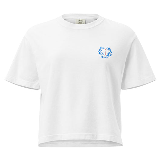 White boxy t-shirt with embroidered design, with bold front text reading ‘PrEP Saves Lives!’ styled in Ivy League-inspired type. Designed by queer creators to promote HIV awareness and access to PrEP through unapologetic activism and education. Front of t-shirt.