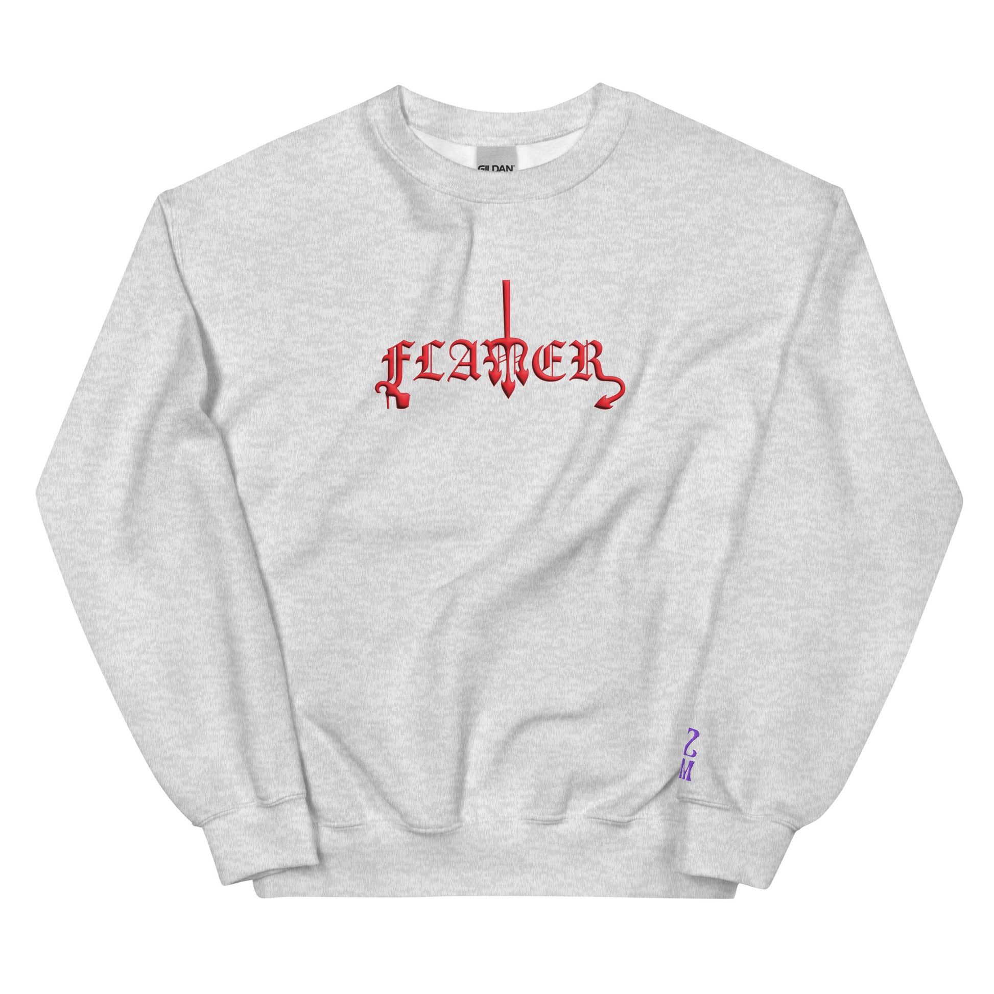 Ash, sweatshirt featuring the word ‘Flamer’ in a bold, illustrative typeface. Reclaiming the phrase “flaming gay,” this design leans into a devil-mascot aesthetic to celebrate every queer who refuses to dim their fire. Designed by a small LGBTQ+ owned business. Front of sweatshirt.