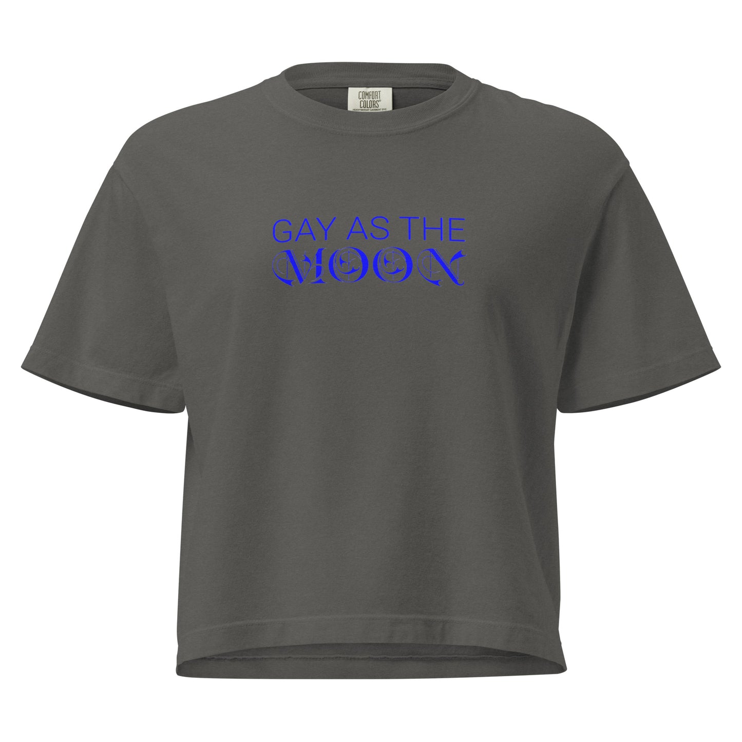 Pepper, boxy t-shirt featuring the phrase ‘Gay as the moon’ in a blue decorative typeface. Playful nod to queer identity and astrology, embracing the idea that the moon is gay. Designed by a small LGBTQ+ owned business. Front of shirt.