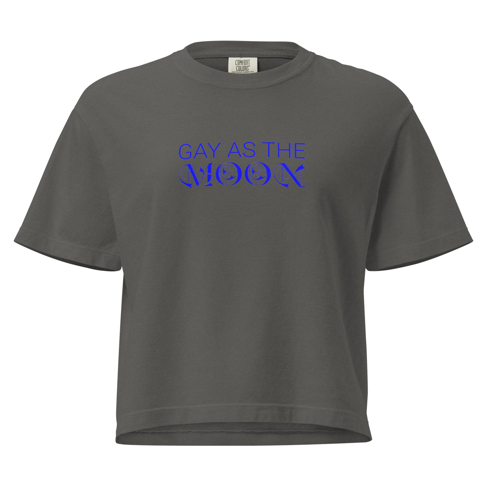 Pepper, boxy t-shirt featuring the phrase ‘Gay as the moon’ in a blue decorative typeface. Playful nod to queer identity and astrology, embracing the idea that the moon is gay. Designed by a small LGBTQ+ owned business. Front of shirt.